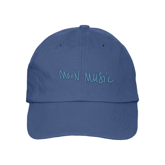 Front: a soft grey-blue baseball cap, with MOON MUSIC embroidered in Chris’s playful, light blue handwritten-style. The letters are slightly uneven, giving it a casual and artistic feel.