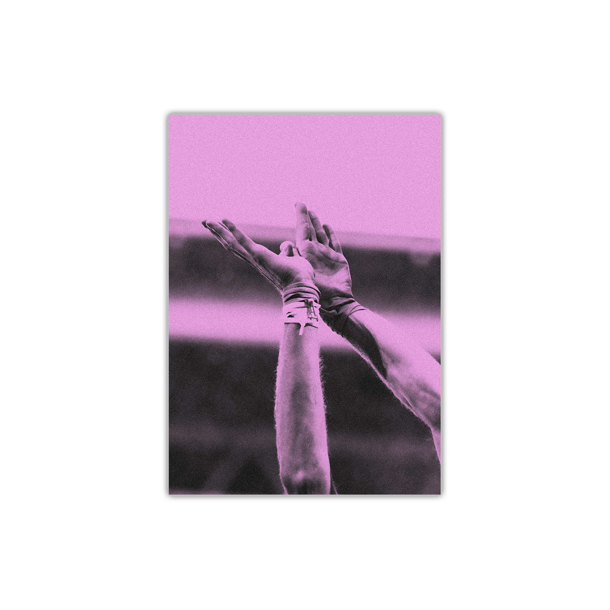 The front shows a close-up of Chris’ hands, thumbs intertwined&palms flat forming the image of a bird in flight. He wears 2 shoestring bracelets on his right wrist&1 on his left. The image is washed in purple. 